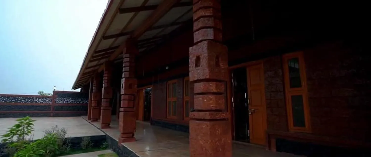Carved laterite pillars — ShivBhumi